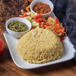 Dakar Attieke Garba au avec 2 poissons